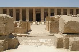 Temple of Seti I at Abydos, Egypt, featuring detailed reliefs and chapels dedicated to multiple deities including Osiris.