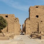 Entrance to the Precinct of Amun-Re at the Karnak Temple Complex in Luxor, Egypt, with the avenue of ram-headed sphinxes leading to the first pylon.