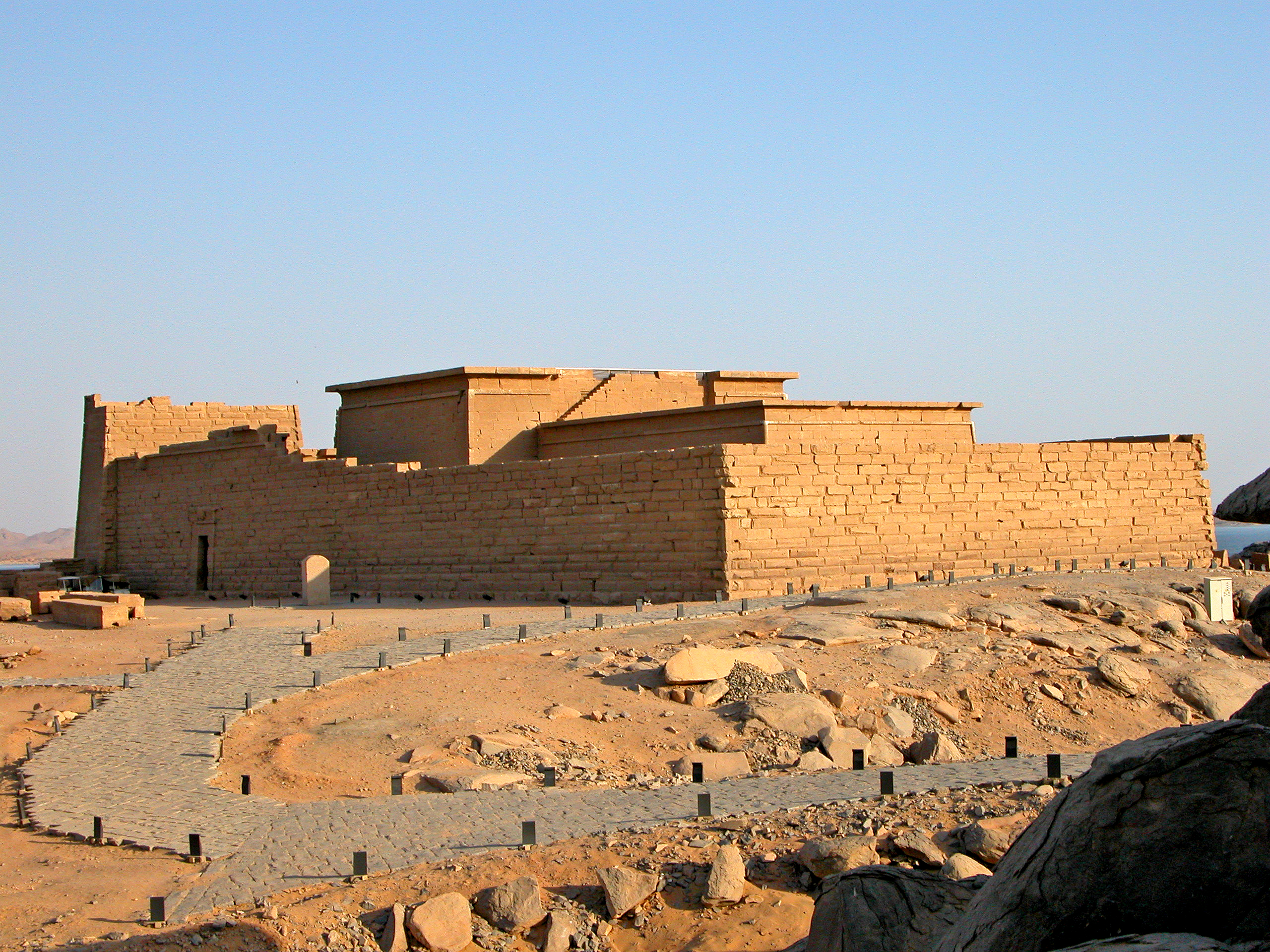 The Temple of Kalabsha, relocated to Lake Nasser near Aswan, Egypt, featuring its monumental pylon and ancient Egyptian and Graeco-Roman architectural elements under a clear sky.