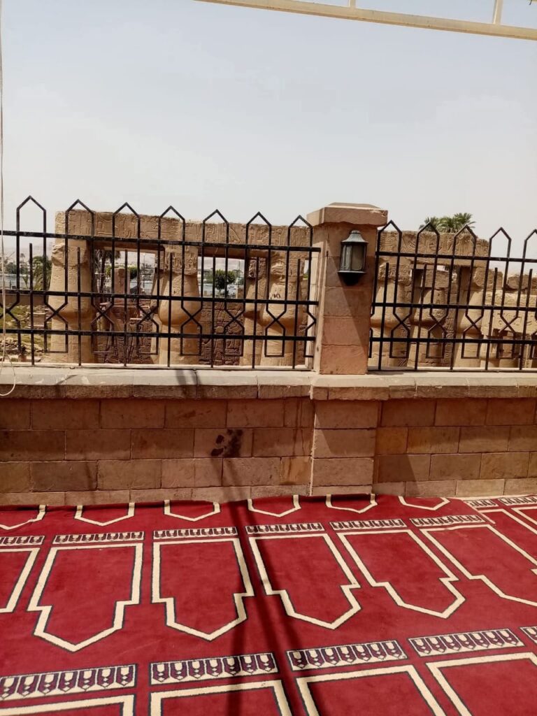"The Abu El-Hagag Mosque built above the ruins of Luxor Temple, blending Islamic and ancient Egyptian architecture."