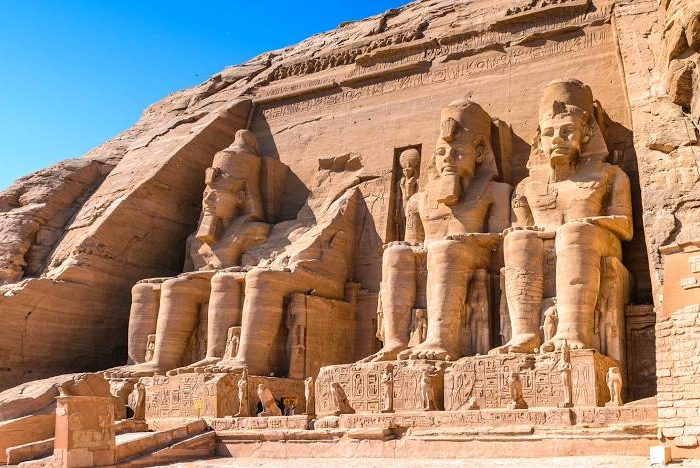 The facade of the Great Temple of Abu Simbel with colossal statues of Ramses II, Nubia, Egypt